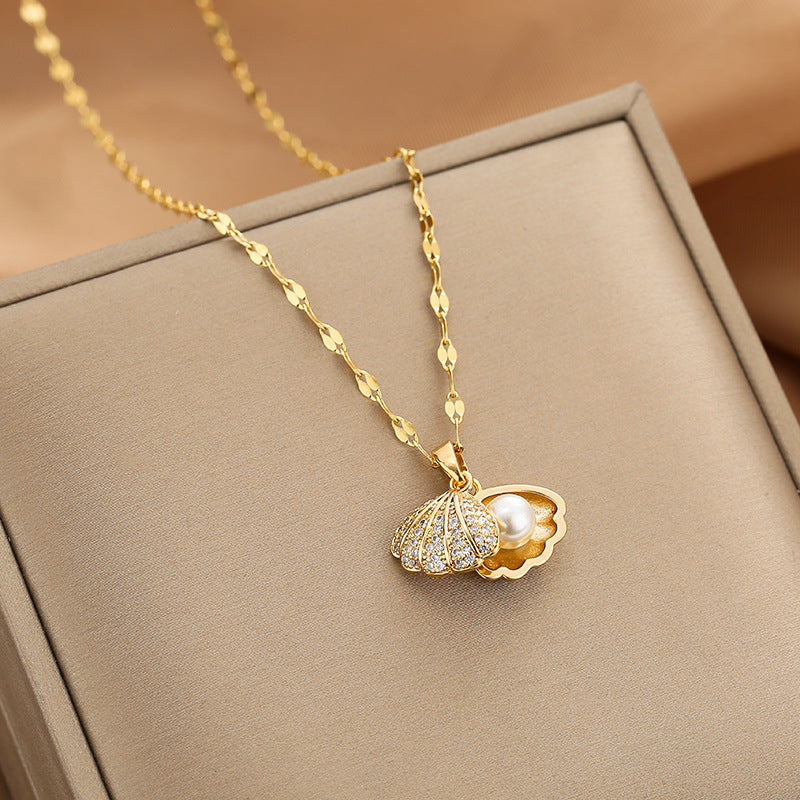 Micropaved zirconia pearl shell necklace