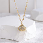 Micropaved zirconia pearl shell necklace