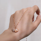 Micropaved zirconia pearl shell necklace