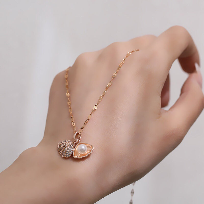 Micropaved zirconia pearl shell necklace