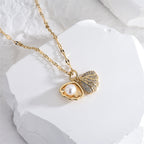 Micropaved zirconia pearl shell necklace