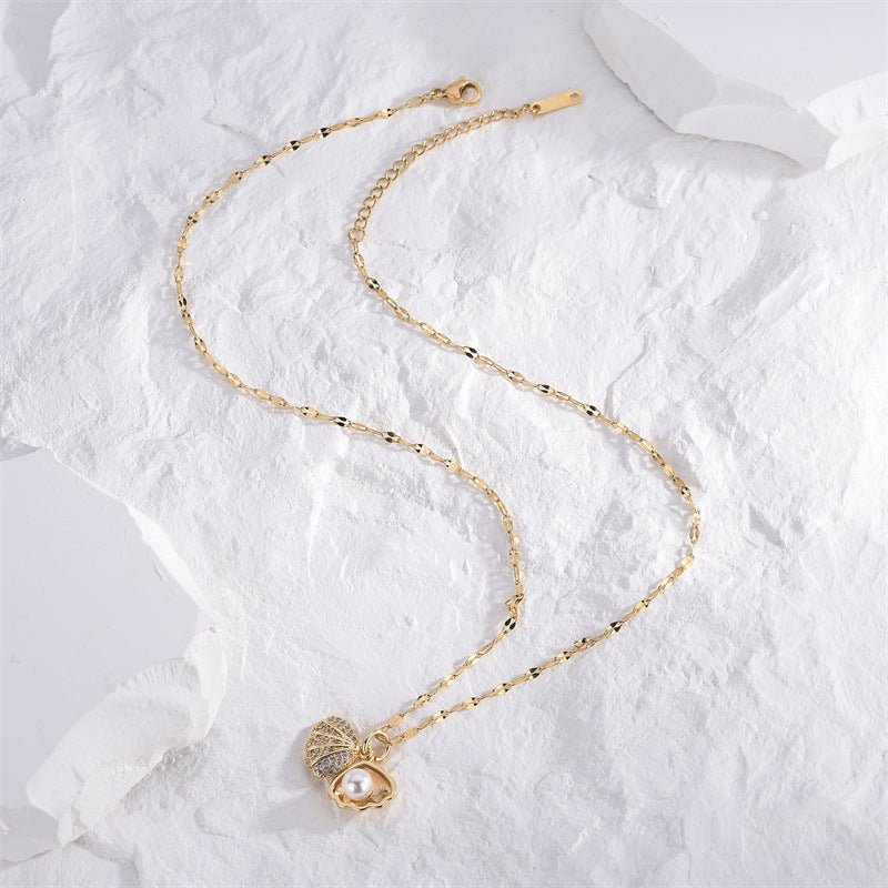 Micropaved zirconia pearl shell necklace