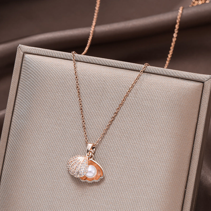 Micropaved zirconia pearl shell necklace