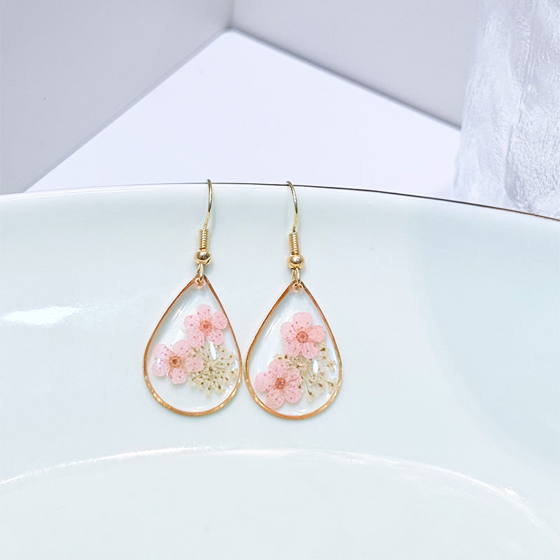 Transparent dried camellia flower drop-shaped earrings