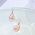 Transparent dried camellia flower drop-shaped earrings