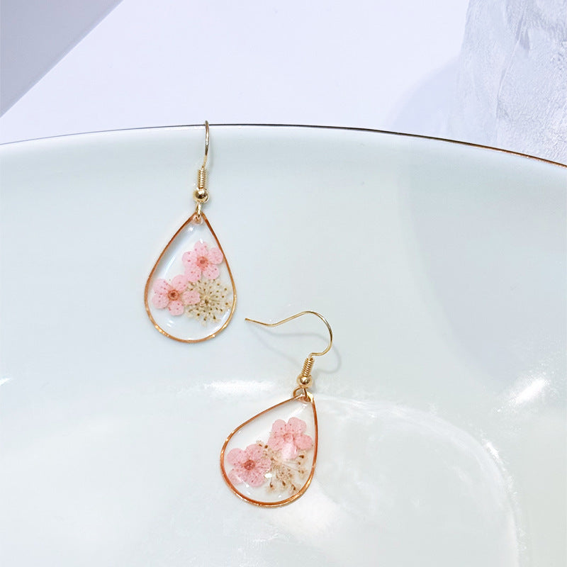 Transparent dried camellia flower drop-shaped earrings