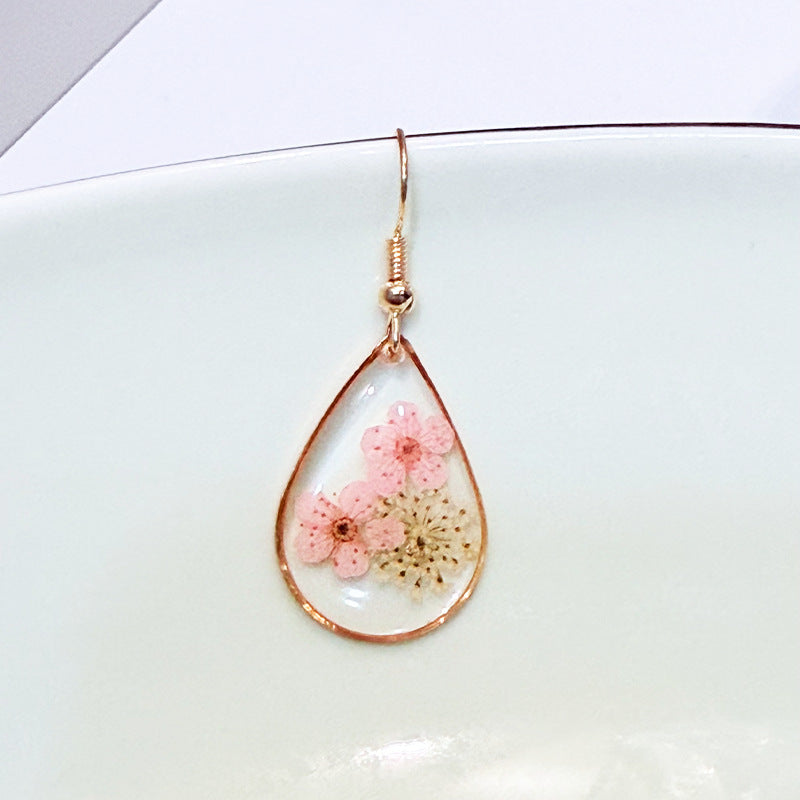 Transparent dried camellia flower drop-shaped earrings