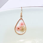 Transparent dried camellia flower drop-shaped earrings